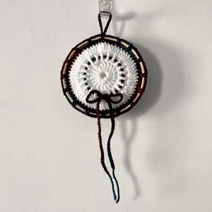Boho dream catcher made with white and maroon yarn